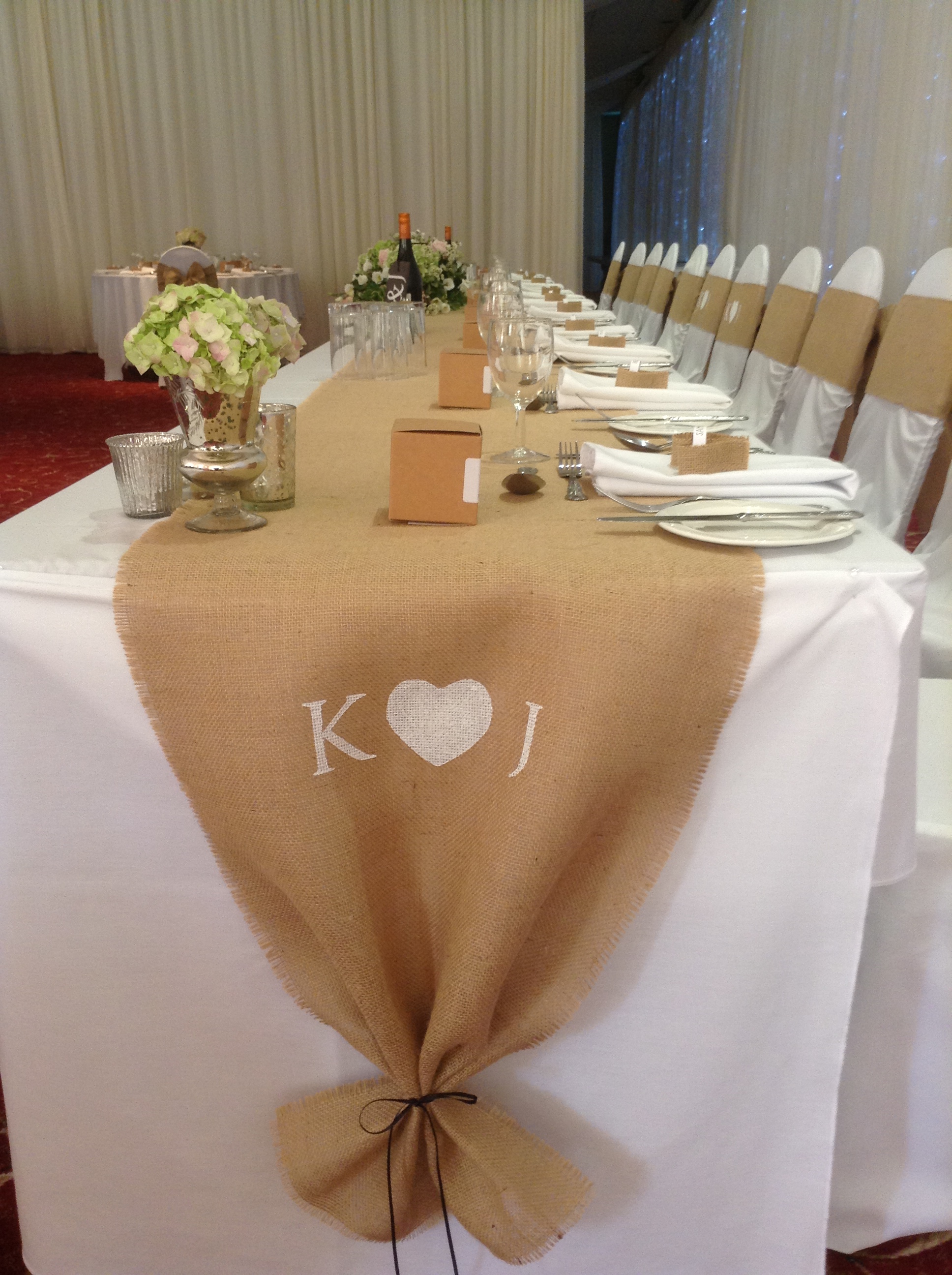 Their hessian table runner was personalised with their initials. By 